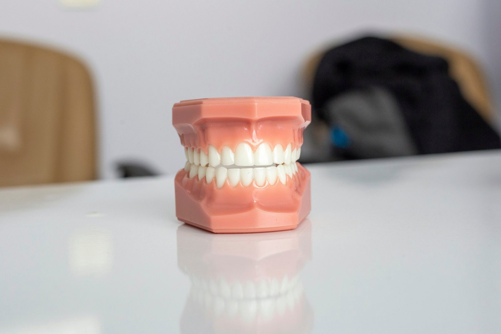 Clear aligners in a protective case on a white background